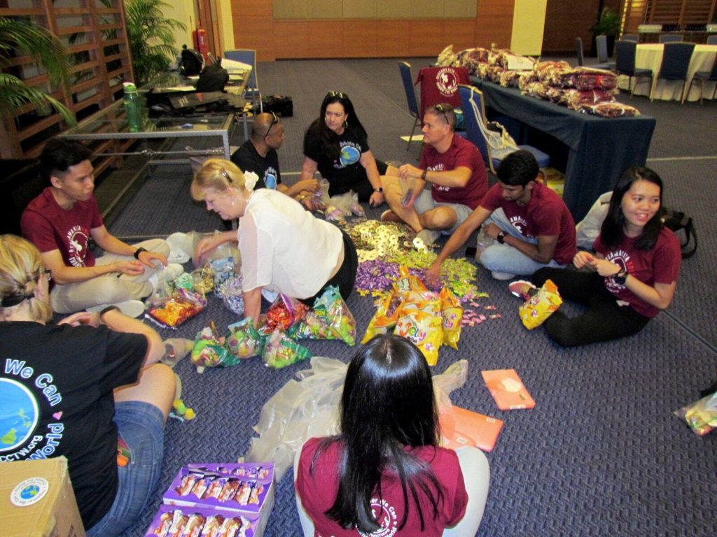 The team assembling the goodie bags for every child!